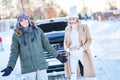 Couple having problem with the car during winter trip Royalty Free Stock Photo