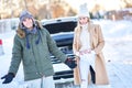 Couple having problem with the car during winter trip Royalty Free Stock Photo