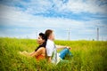 Couple having rest in the meadow Royalty Free Stock Photo