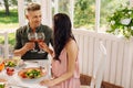 Couple having romantic lunch eating salads and drinking wine Royalty Free Stock Photo