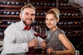 Couple having romantic wine tasting at the cellar Royalty Free Stock Photo