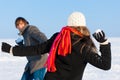 Couple having snowball fight Royalty Free Stock Photo