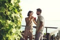 Couple having spritz time with lake view