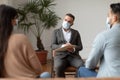 Couple having therapy session with therapist, man taking notes Royalty Free Stock Photo