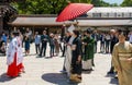 Couple are having a wedding ceremony in Meji Shrine, Tokyo. Royalty Free Stock Photo