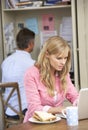 Couple Having Working Lunch In Home Office Together