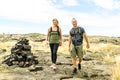 Couple at the Hawaii Volcano National Park, Pu u Loa petroglyphs, amazing walk into the past. Royalty Free Stock Photo