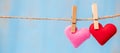 Couple heart shape decoration hanging on line with copy space for text on blue wooden background. Love, Wedding, Romantic and Royalty Free Stock Photo