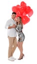 Lovely couple with heart shaped balloons on white background. Valentine`s day celebration Royalty Free Stock Photo