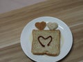 Couple Heart shaped on Whole Wheat Bread put on white tray, background love Valentine Day Royalty Free Stock Photo