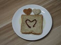 Couple Heart shaped on Whole Wheat Bread put on white tray, background love Valentine Day Royalty Free Stock Photo