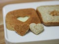 Couple Heart shaped on Whole Wheat Bread put on white tray, background love Valentine Day Royalty Free Stock Photo