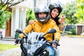 Couple with helmets riding motorcycle Royalty Free Stock Photo