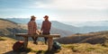 Couple of Hikers With Backpacks in Front of Landscape Valley View on Top of a Mountain Royalty Free Stock Photo