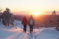 Couple of hikers with backpacks hiking in winter mountains at sunset with Generative AI. Royalty Free Stock Photo