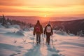 Couple of hikers with backpacks hiking in winter mountains at sunset with Generative AI. Royalty Free Stock Photo