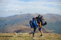 Couple hikers in the Carpathians mountains with backpacks Royalty Free Stock Photo