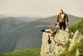 Couple hikers enjoy view. Hiking peaceful moment. Tourist hiker girl and man relaxing. Hiking benefits. Hiking weekend