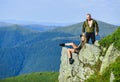 Couple hikers enjoy view. Hiking peaceful moment. Tourist hiker girl and man relaxing. Hiking benefits. Hiking weekend