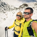 Couple hikers, partnership and teamwork in winter mountains Royalty Free Stock Photo