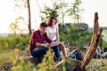 Couple hikers in the mountains, they is looking at map Royalty Free Stock Photo