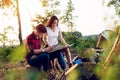 Couple hikers in the mountains, they is looking at map Royalty Free Stock Photo