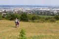 Couple of hikers standing on the Perchtoldsdorf heath and looking at the city of Vienna, Austria