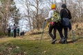 Couple of hikers walk on the path in the woods