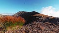 A couple of hikers walking on the ridge of mountain