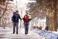 Couple of hikers walking and talking in nature