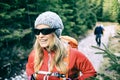 Couple hikers walking on trail in forest Royalty Free Stock Photo