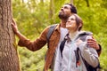 Couple Hiking Along Path Through Forest In Countryside Taking A Break And Resting Against Tree Royalty Free Stock Photo