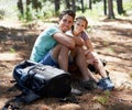 Couple, hiking break and portrait in forest for outdoor travel, adventure and wellness journey in nature. Happy man and Royalty Free Stock Photo