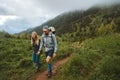 Couple hiking in foggy mountains family traveling outdoor adventure vacations healthy lifestyle