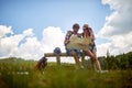 couple hiking in forest, looking at map and planning hike