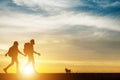 Couple hiking help teamwork and trust silhouette walking during