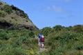 Couple hiking in KareKare beach New Zealand