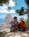 Couple hiking in the mountains Saint Lucia Caribbean, nature trail in the jungle of Saint Lucia with a look at the huge