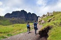 Couple hiking the Old Man of Storr trail Royalty Free Stock Photo