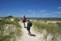 Couple hiking on the pathway among the sand dunes Royalty Free Stock Photo