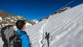 Couple hiking on snow with scenic view on Hoher Sonnblick in High Tauern mountains in Carinthia, Salzburg, Austria, Europe, Alps.