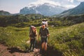 Couple hiking travel with baby in backpack family vacation in mountains Royalty Free Stock Photo