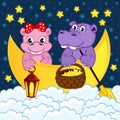Couple of hippos float on moon in clouds Royalty Free Stock Photo