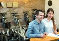 Couple hiring segways ot rental store