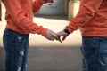 two lovers hold hands. sunny day walk. heart Royalty Free Stock Photo