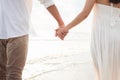 Couple hold hands on beach. Romantic couple on the beach Royalty Free Stock Photo