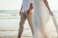 Couple hold hands on beach. Romantic couple on the beach Royalty Free Stock Photo