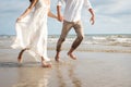 Couple hold hands on beach. Romantic couple on the beach Royalty Free Stock Photo