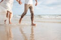 Couple hold hands on beach. Romantic couple on the beach Royalty Free Stock Photo