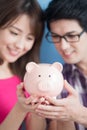 Couple hold pink piggy bank Royalty Free Stock Photo